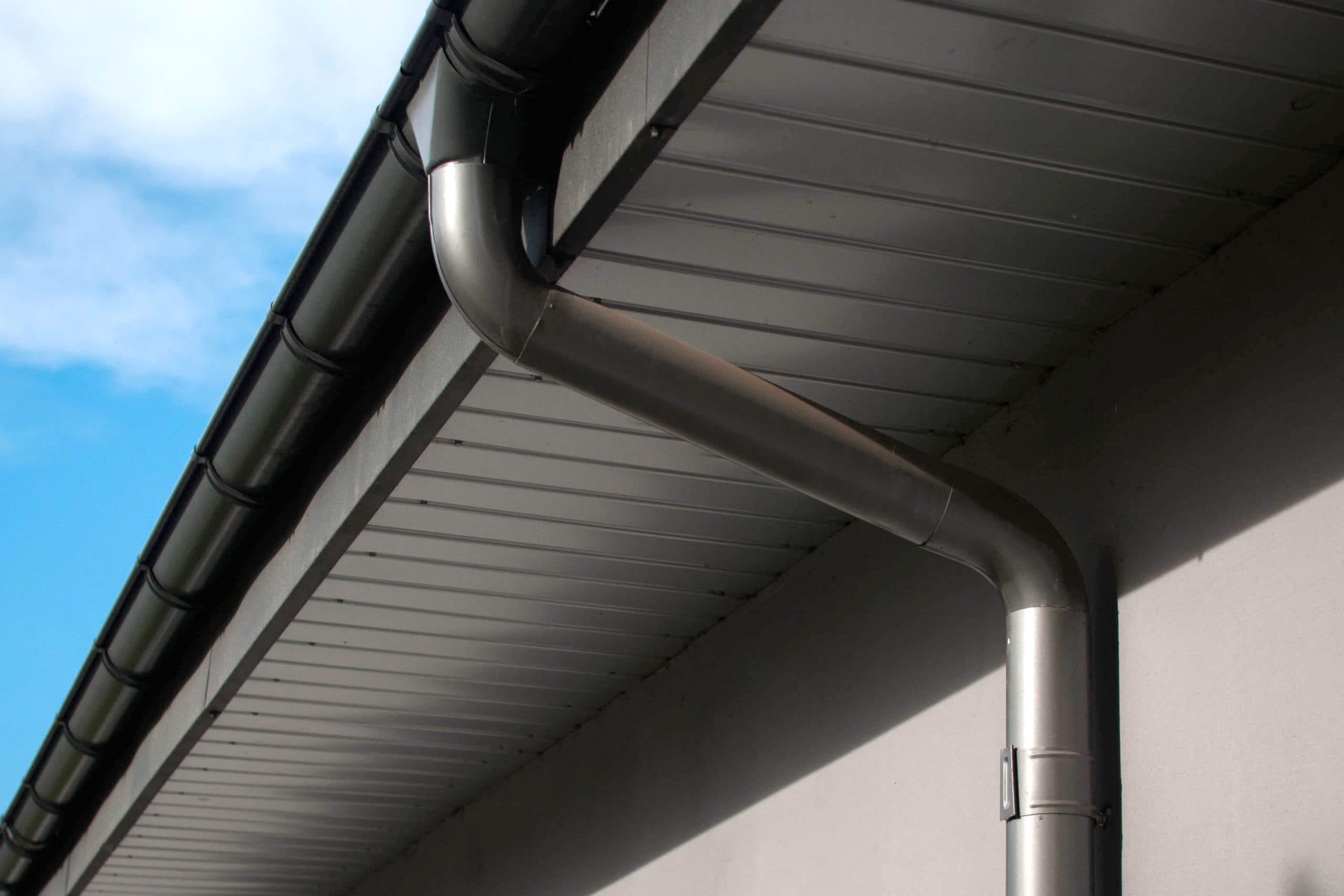 Corrosion-resistant galvanized gutters installed on a commercial building in Tulsa
